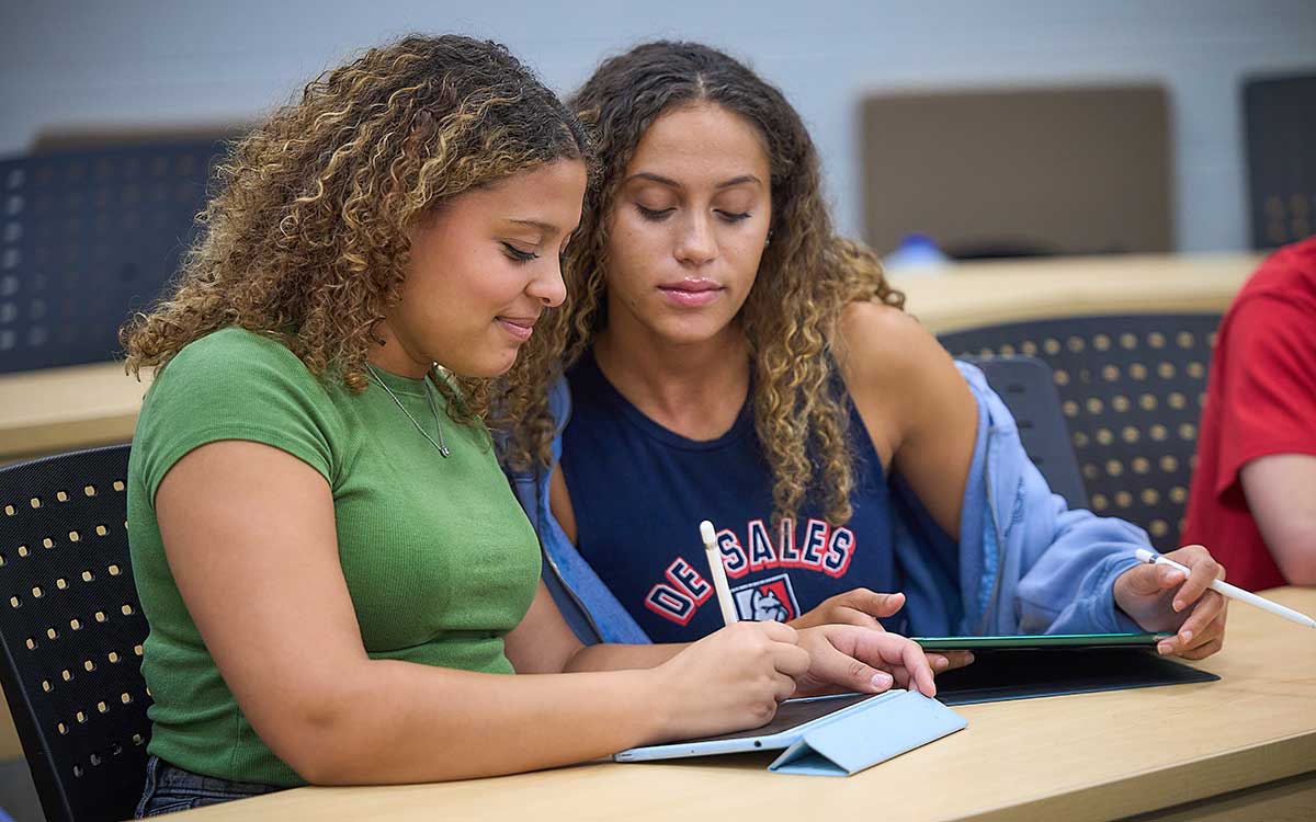 two girls studying