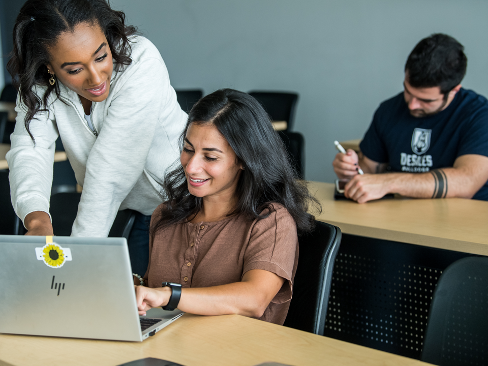 student helping another student