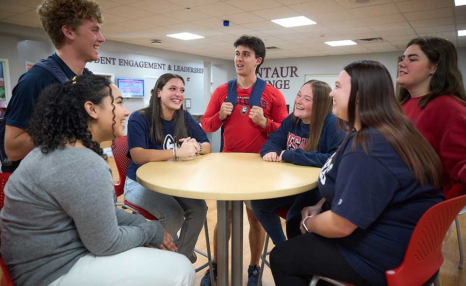 students gathering at a table