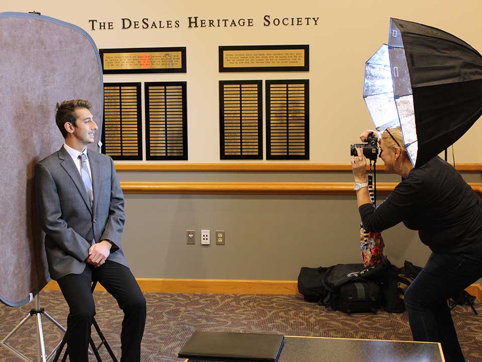 student getting headshot photos