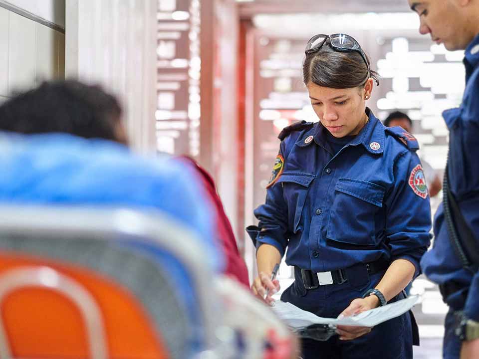 group of paramedics working on a patient