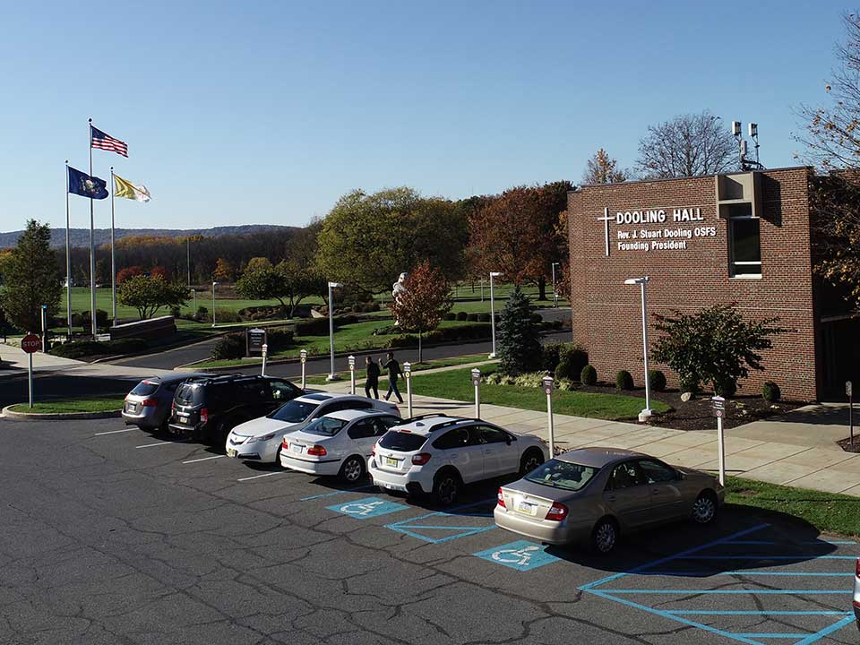 cars in a parking lot on campus