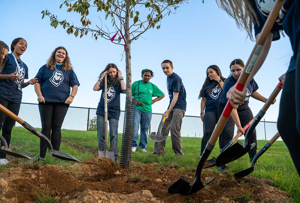 students planting a tree