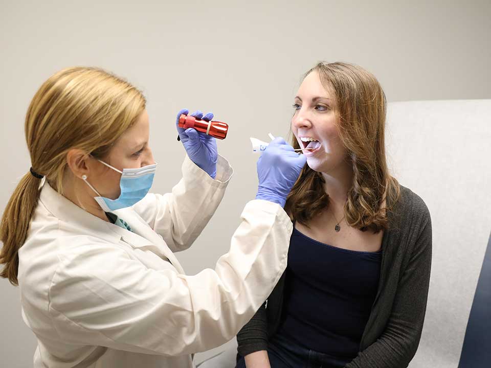 student performing swallowing assessment