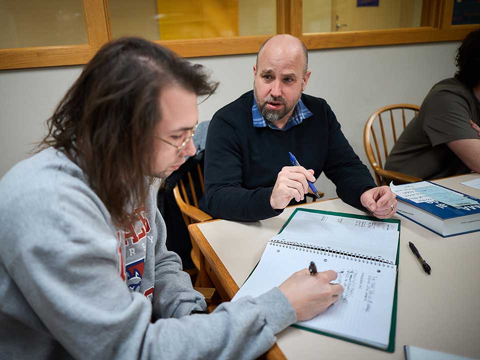 professor working with student