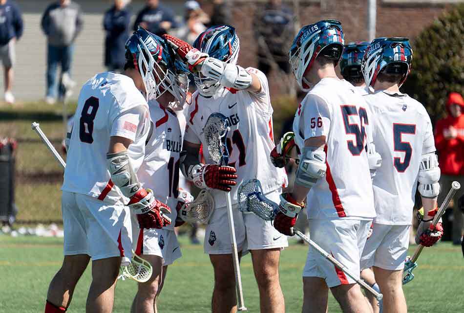 lacrosse players celebrating a goal