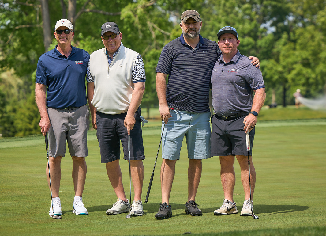 employees playing golf