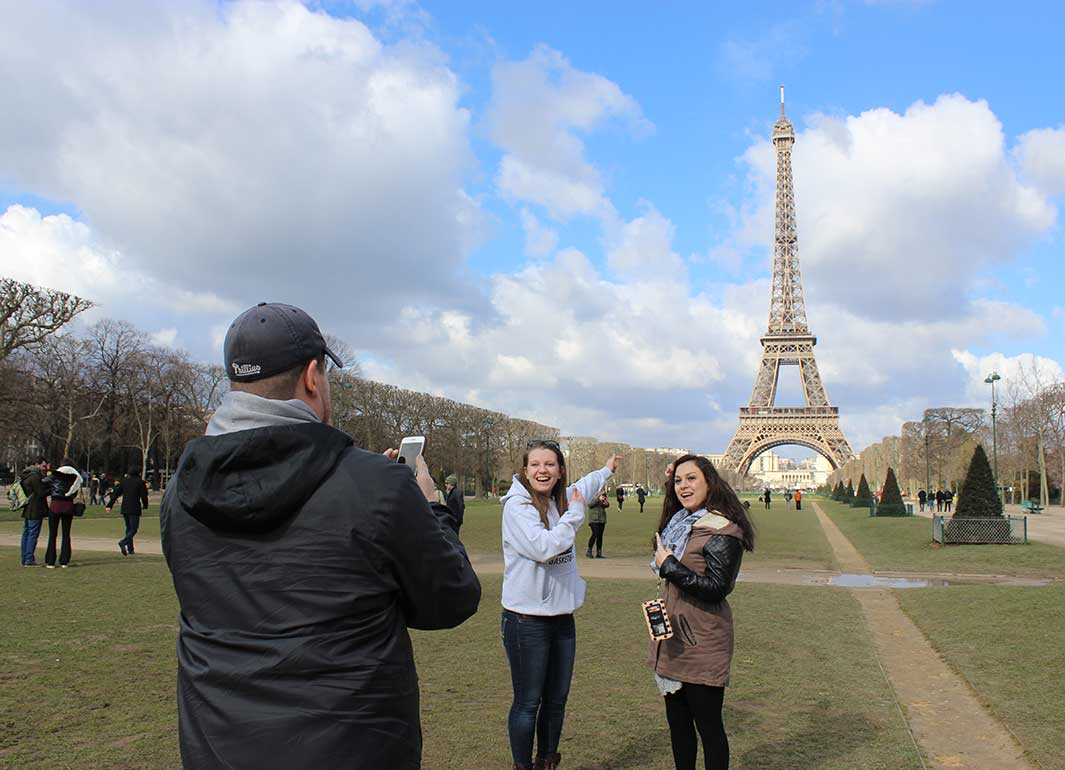 students in front of the Eiffel Tower