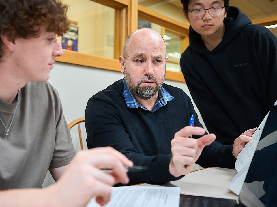 students looking at documents