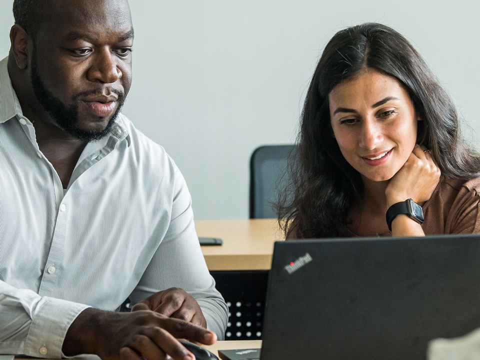 students looking at a laptop