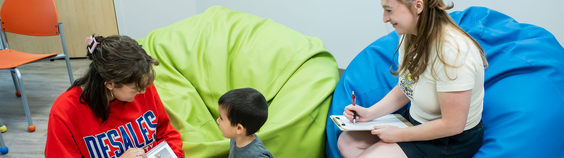 student talking to a child