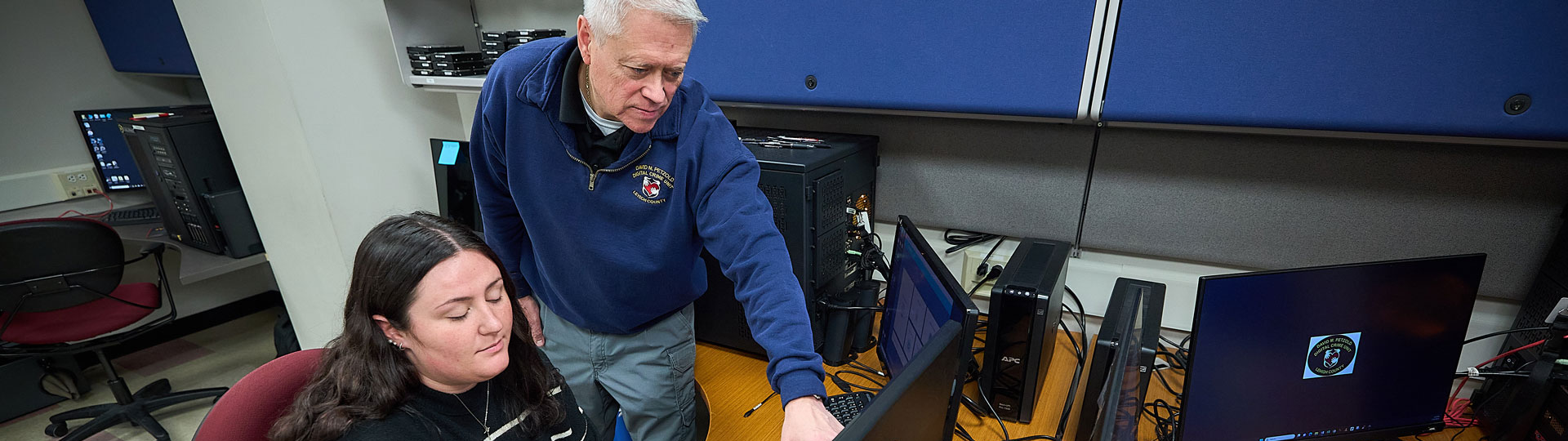 Two people working on a computer