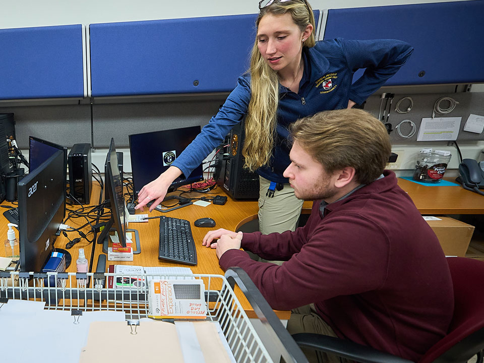 two students looking at a computer