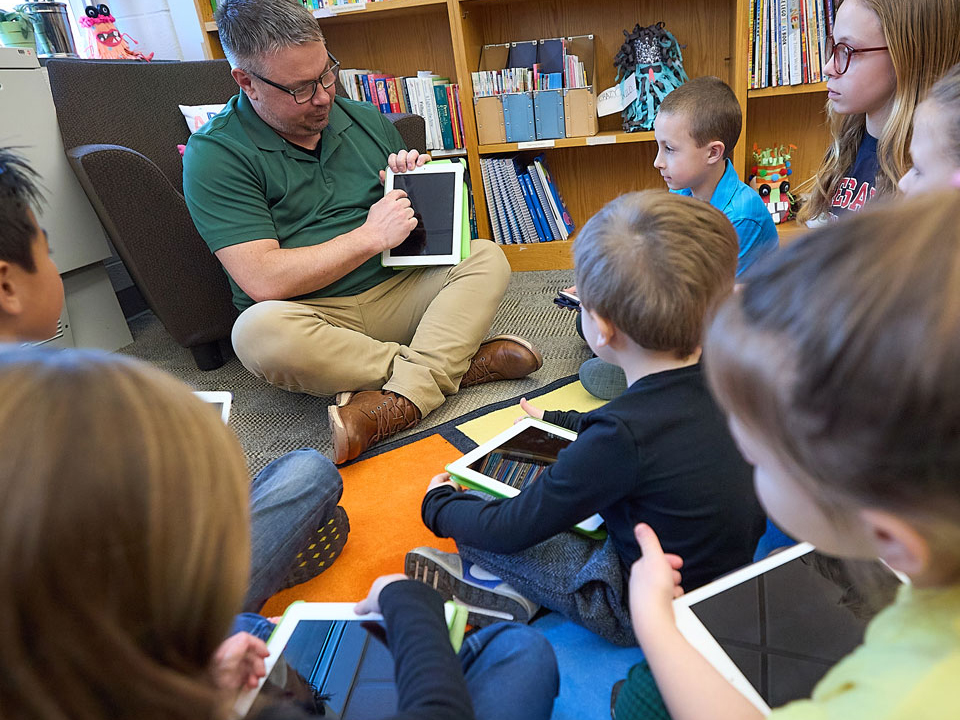 children listening to a teacher