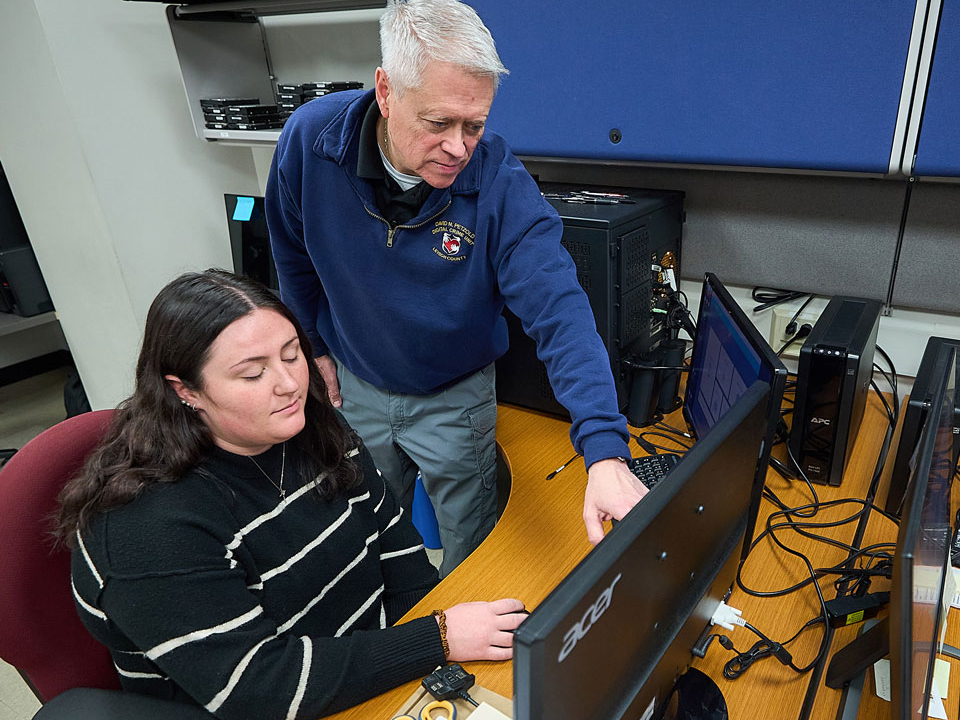 student looking at a computer