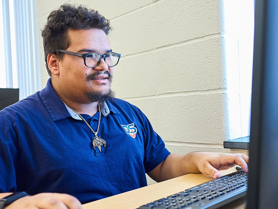 student working on laptop