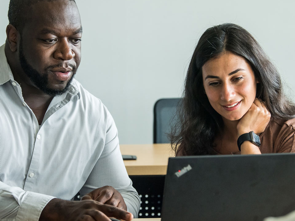 two students looking at a computer