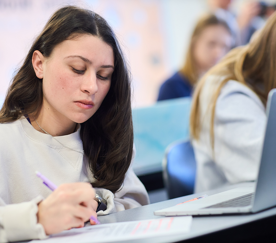 student taking notes