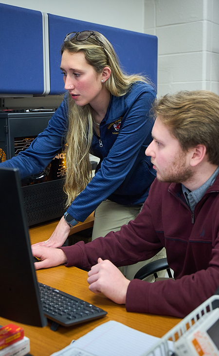 students working together on a computer