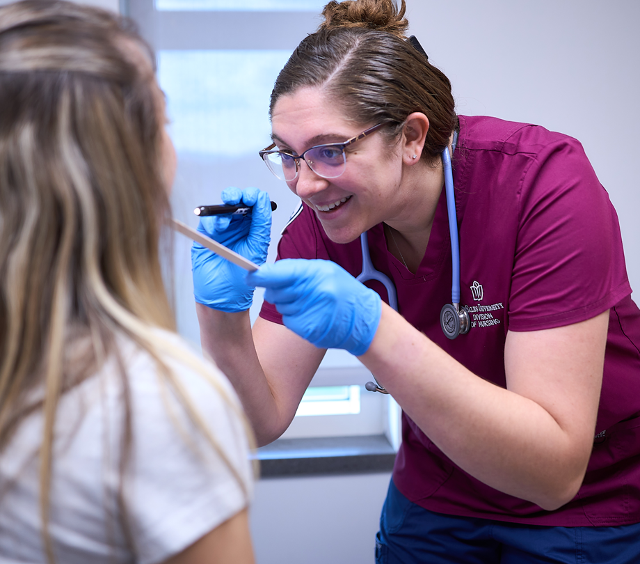 nursing student performing checkup