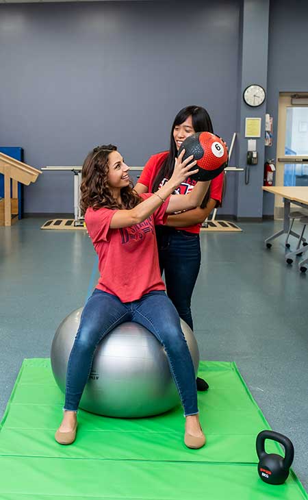 students training physical therapy techniques