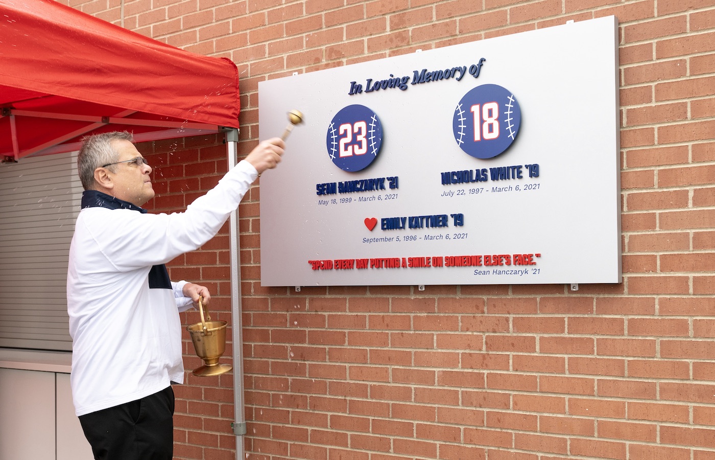 Father Kevin Nadowski blessing the plaque