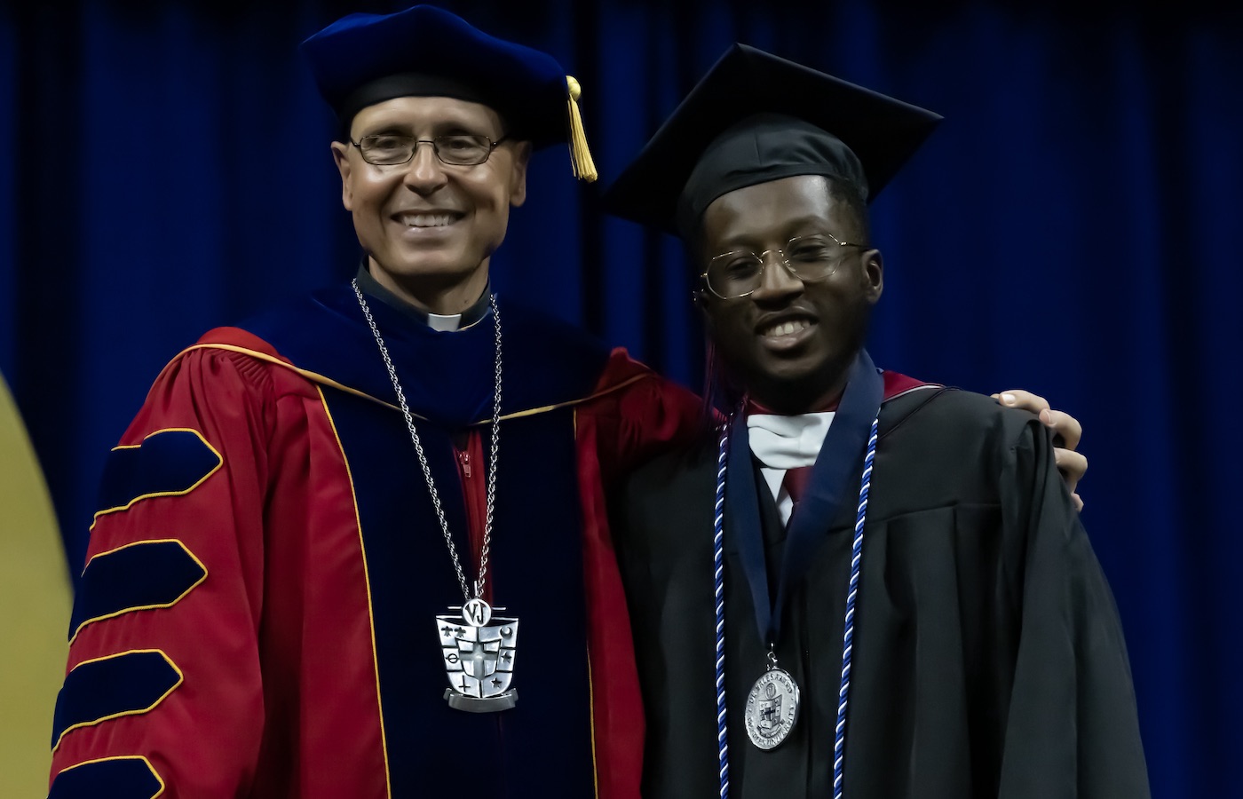 Xavier Gordon with Fr. Greenfield